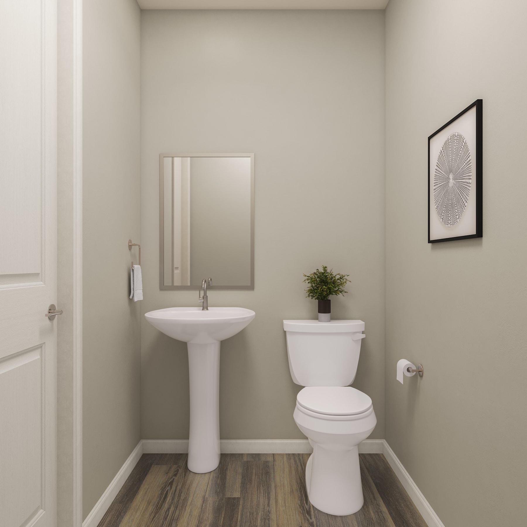 A simple and clean bathroom with a pedestal sink, toilet, and a framed artwork on the wall.