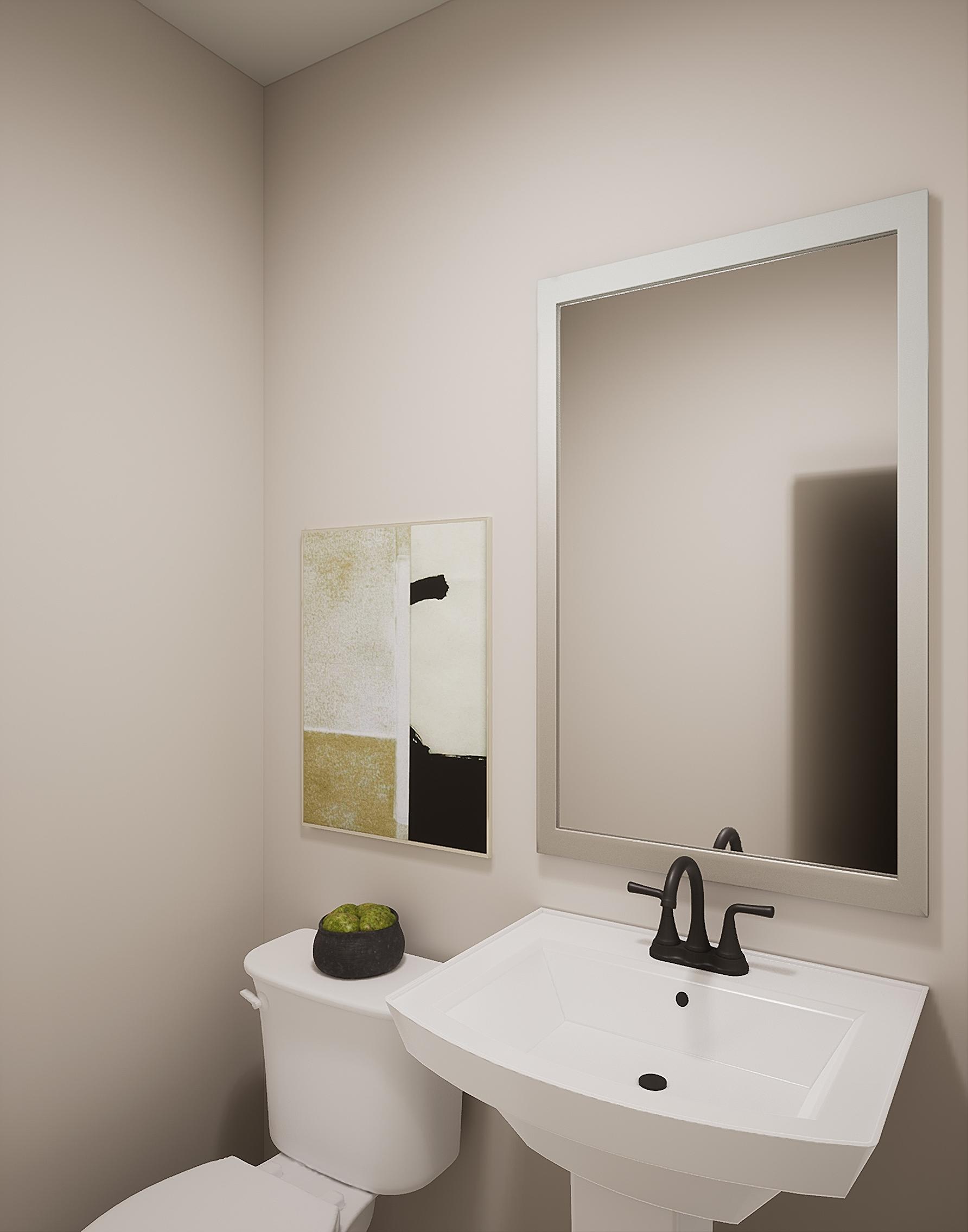 A modern bathroom with a white sink, a framed artwork on the wall, and a large mirror.