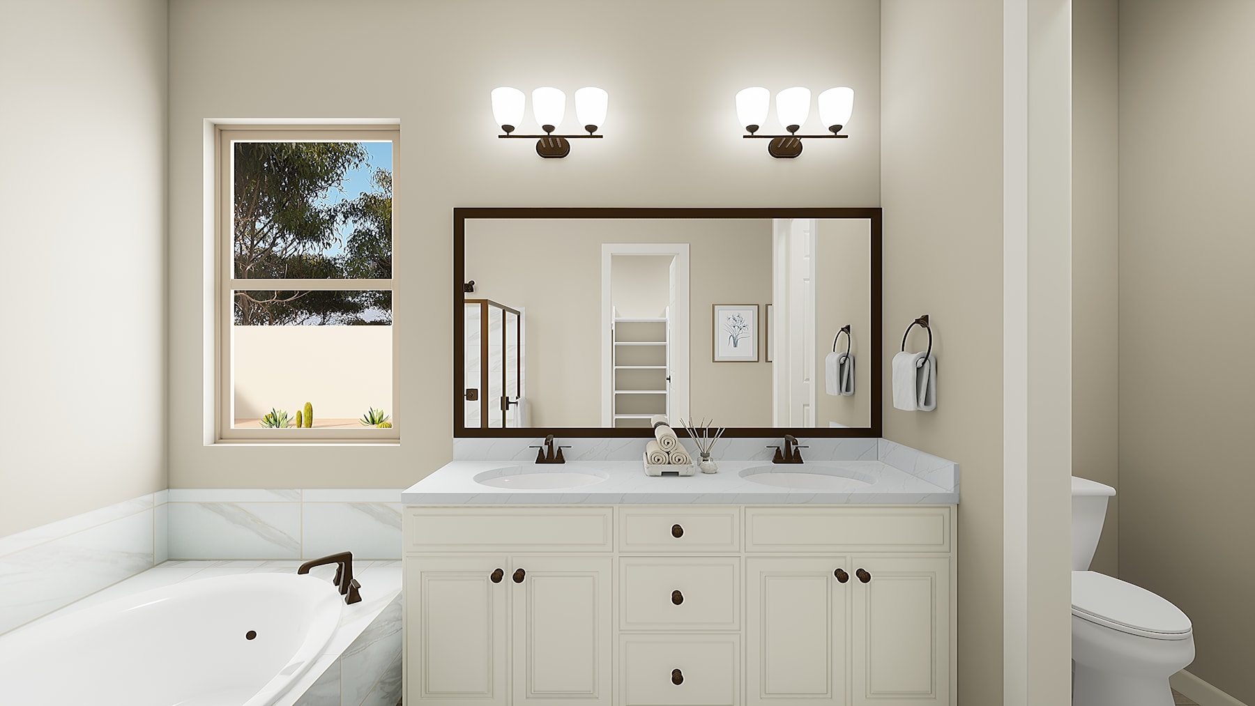 A modern and well-lit bathroom with a white vanity, a large mirror, and wall sconces. The room features a window overlooking a natural outdoor scene.