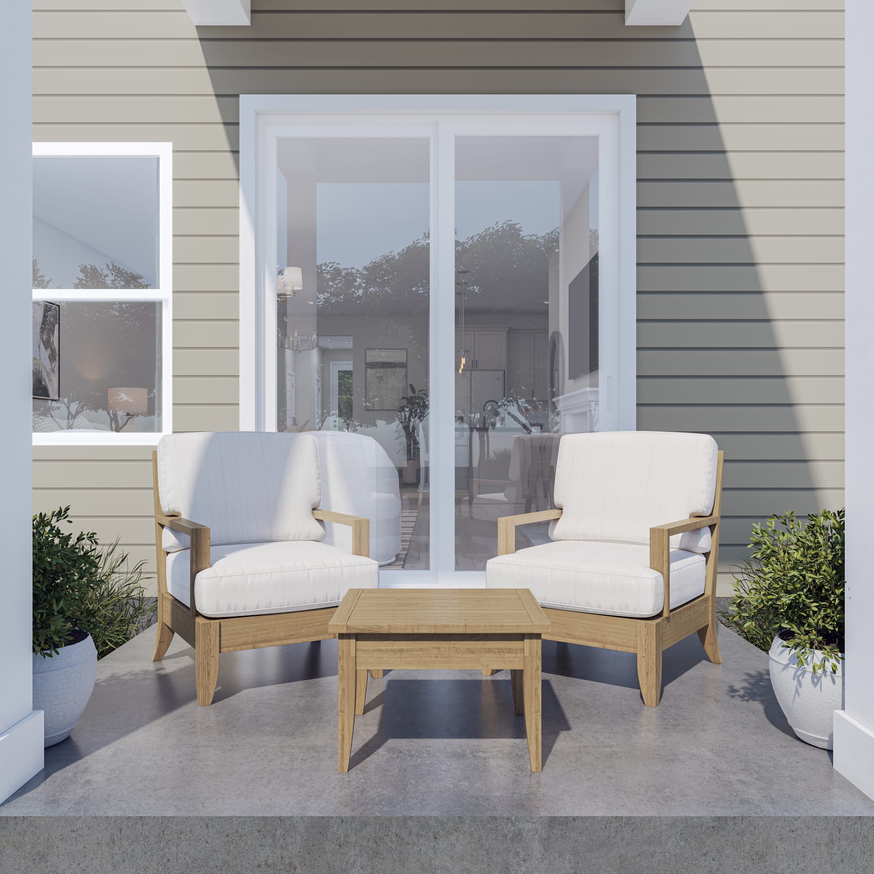 A cozy outdoor seating area with two white armchairs and a wooden coffee table, set against the backdrop of a modern, light-colored house with large windows.