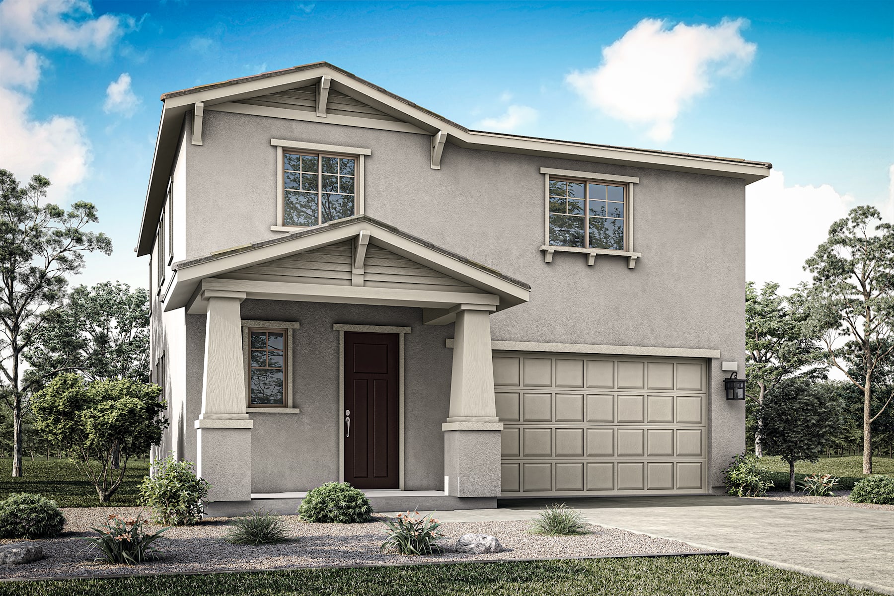 A two-story gray house with a garage door, surrounded by trees and a well-manicured lawn in the foreground.