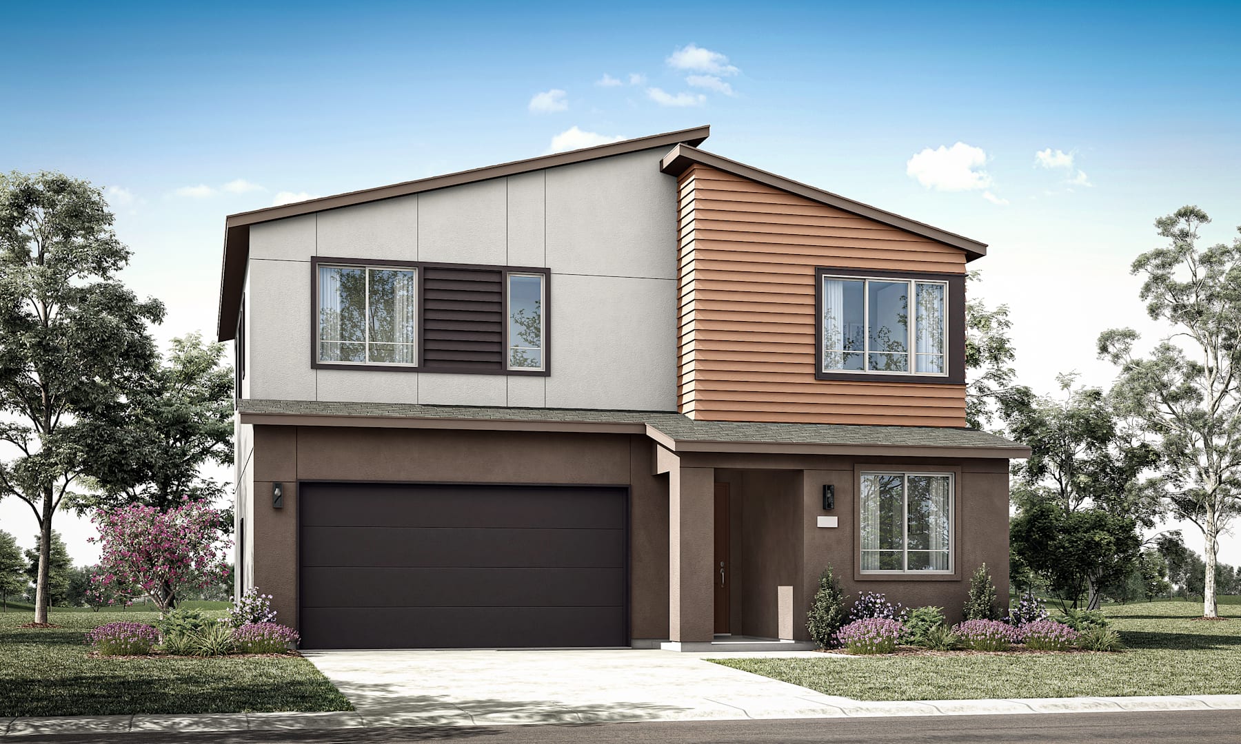 A two-story residential house with a garage, surrounded by trees and landscaping, set against a clear blue sky with some clouds.