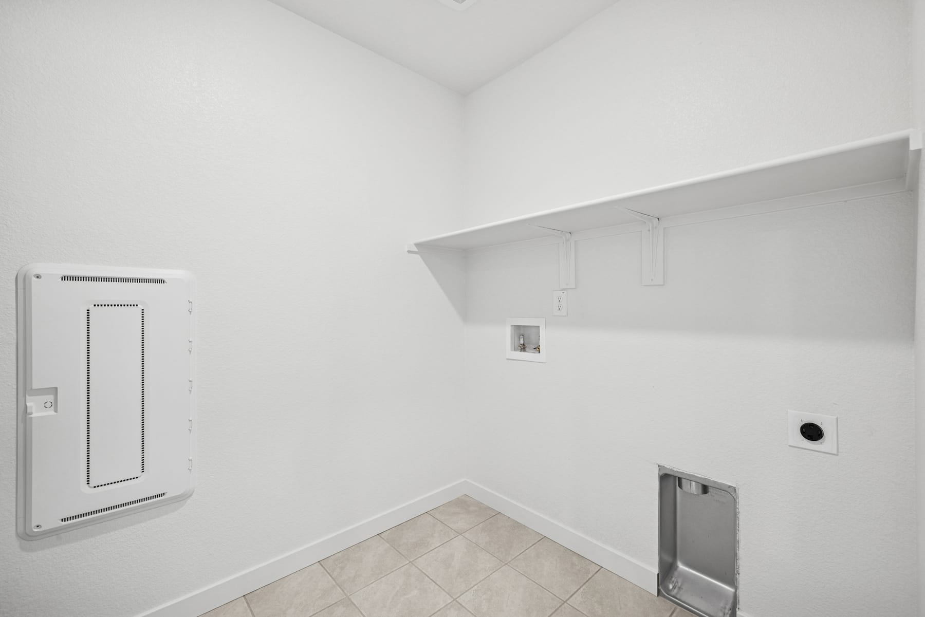 A white, minimalist room with a tiled floor, a recessed wall niche, and a door frame visible in the background.
