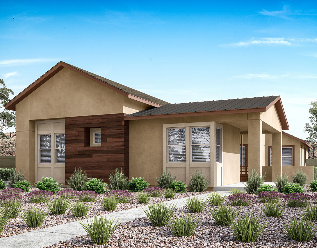 A modern, two-story residential building with a mix of stucco and wood siding, surrounded by a well-landscaped yard featuring grassy areas and decorative plants.