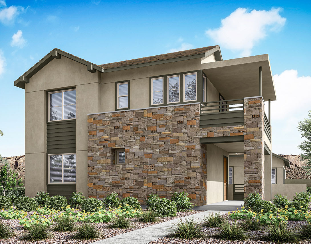 A modern two-story residential building with a stone facade, surrounded by lush greenery and a clear blue sky in the background.