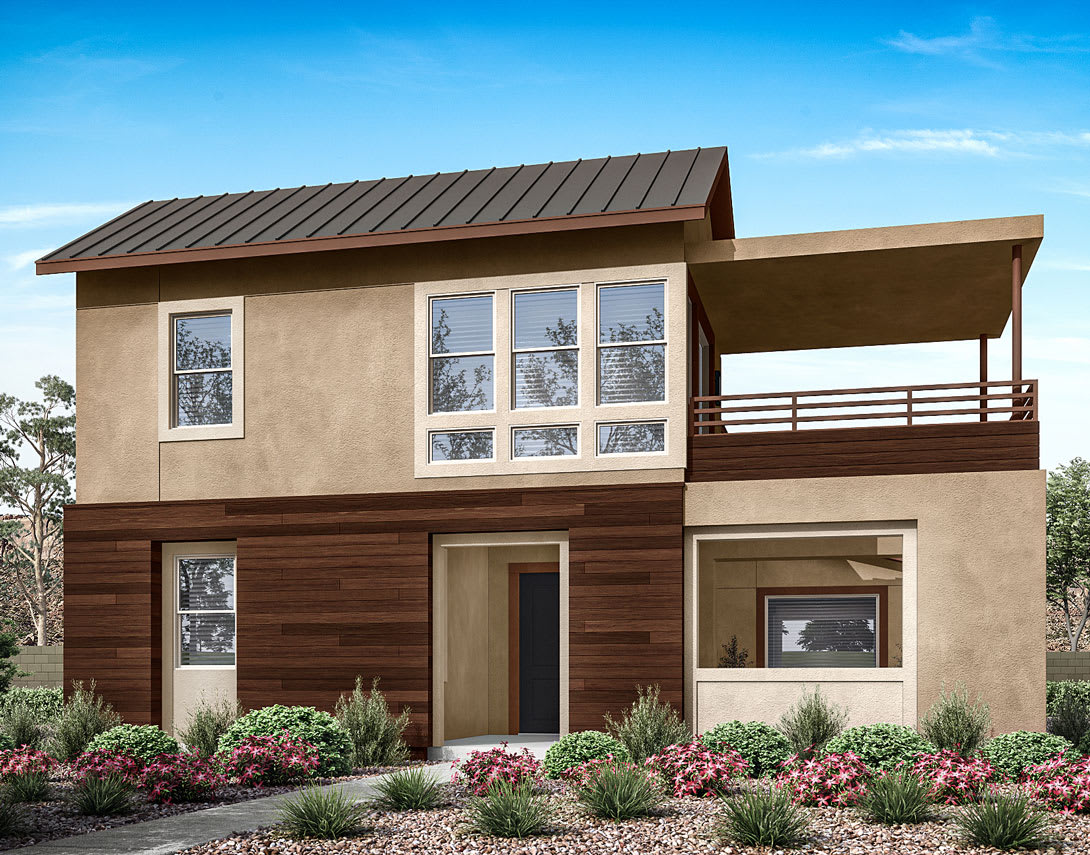 A two-story modern house with a slanted metal roof, surrounded by lush landscaping and a clear blue sky in the background.