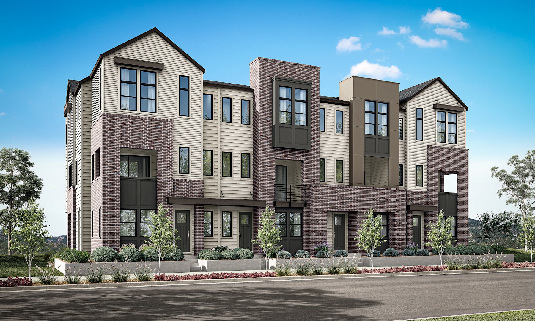 A modern multi-story residential building with a mix of siding materials, including wood and brick, surrounded by landscaping and a paved road in the foreground.