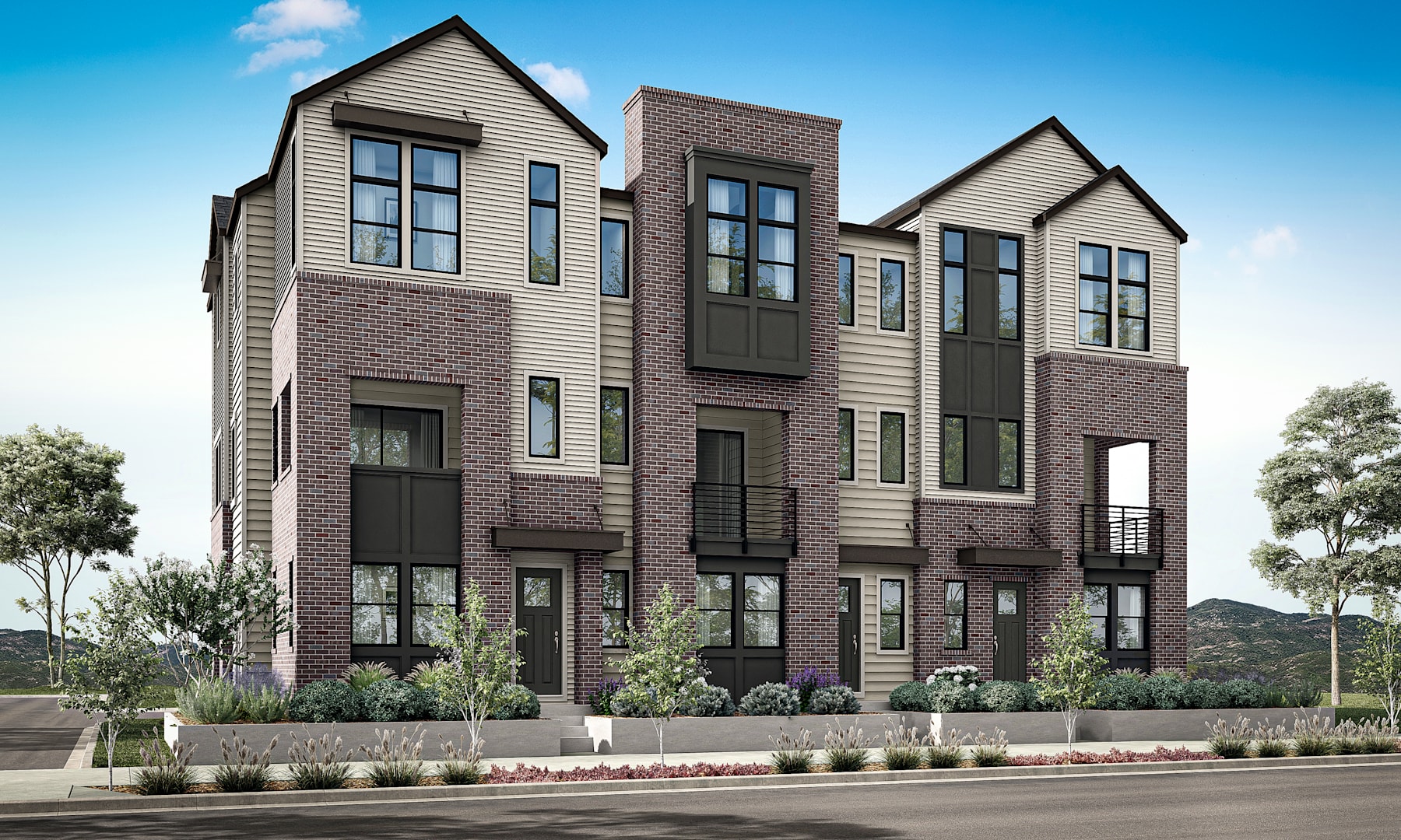 A multi-story residential building with a mix of brick and siding exterior, surrounded by landscaping and a paved street in the foreground.
