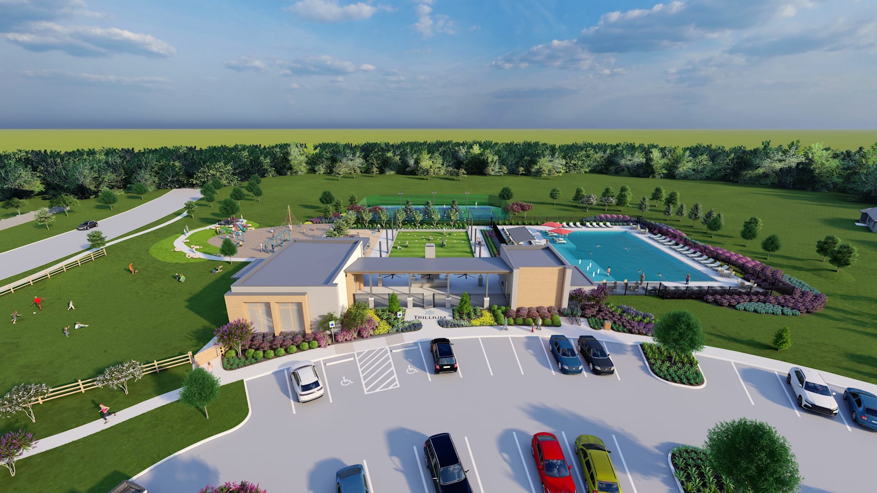 A sprawling outdoor recreational complex with a large swimming pool, various buildings, and lush green landscaping surrounded by a forested area in the background.