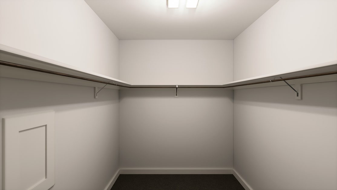 A simple, minimalist closet space with white walls, a ceiling light fixture, and metal hanging rods for storage.