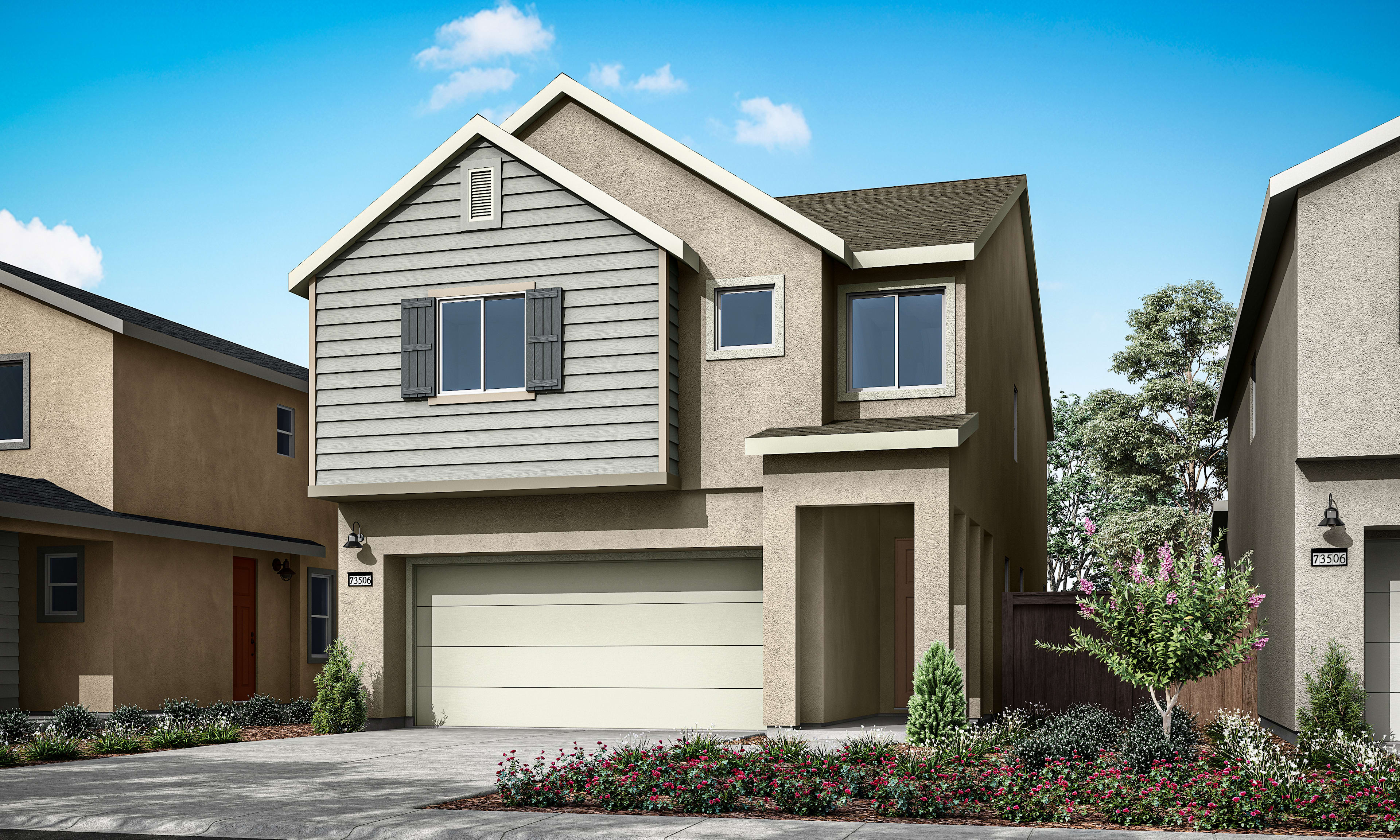 A two-story residential house with a garage, surrounded by landscaped gardens and a clear blue sky in the background.