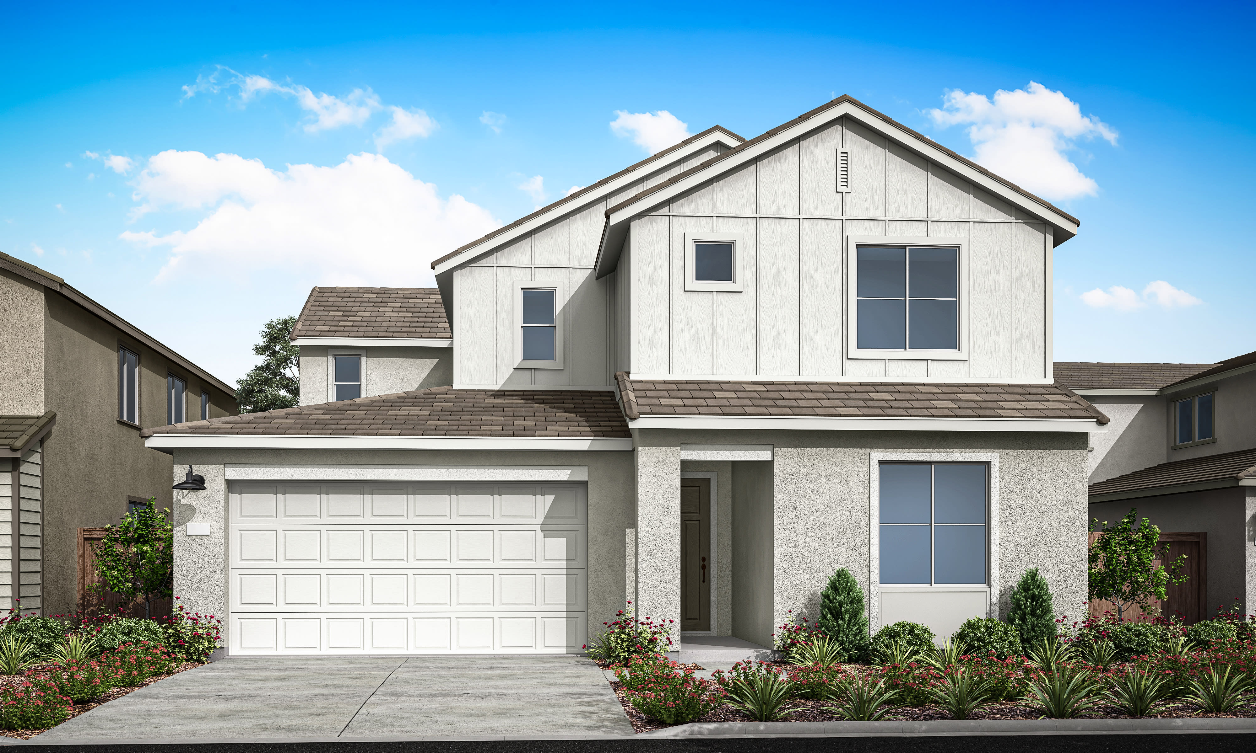 A two-story white house with a garage door, surrounded by landscaped gardens and a clear blue sky with fluffy clouds.