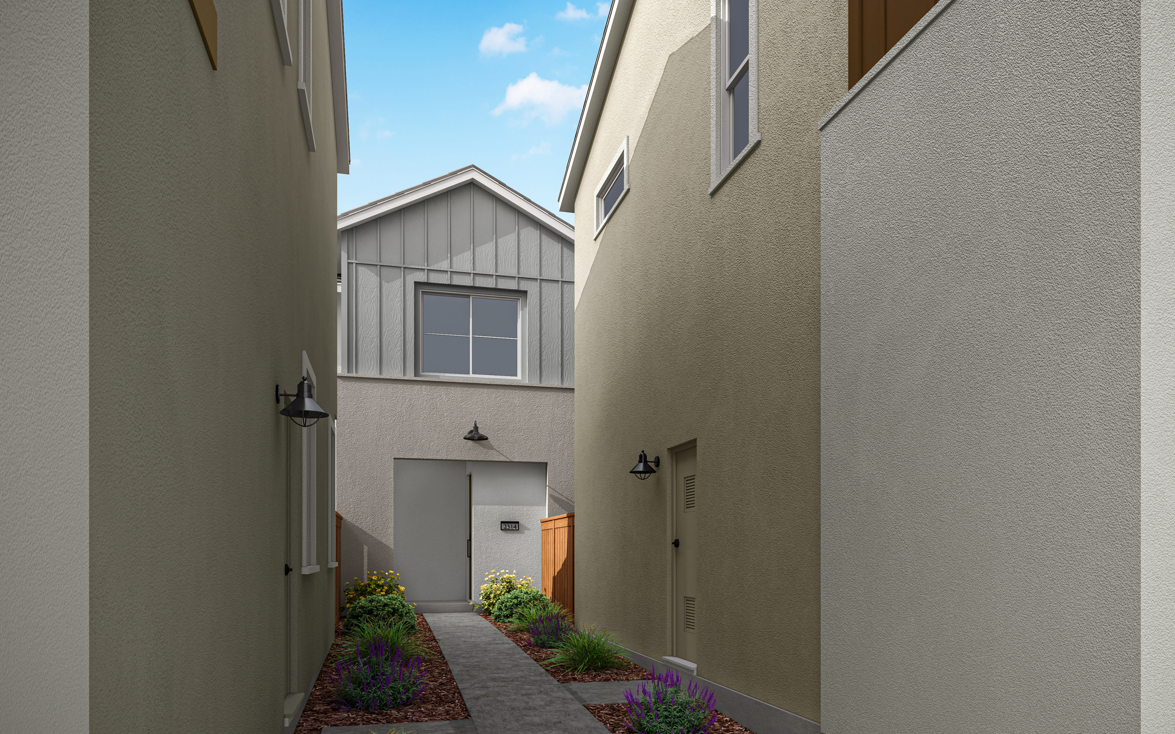 A narrow alleyway between two buildings, with a gray-sided structure in the background and a small garden area in the foreground.