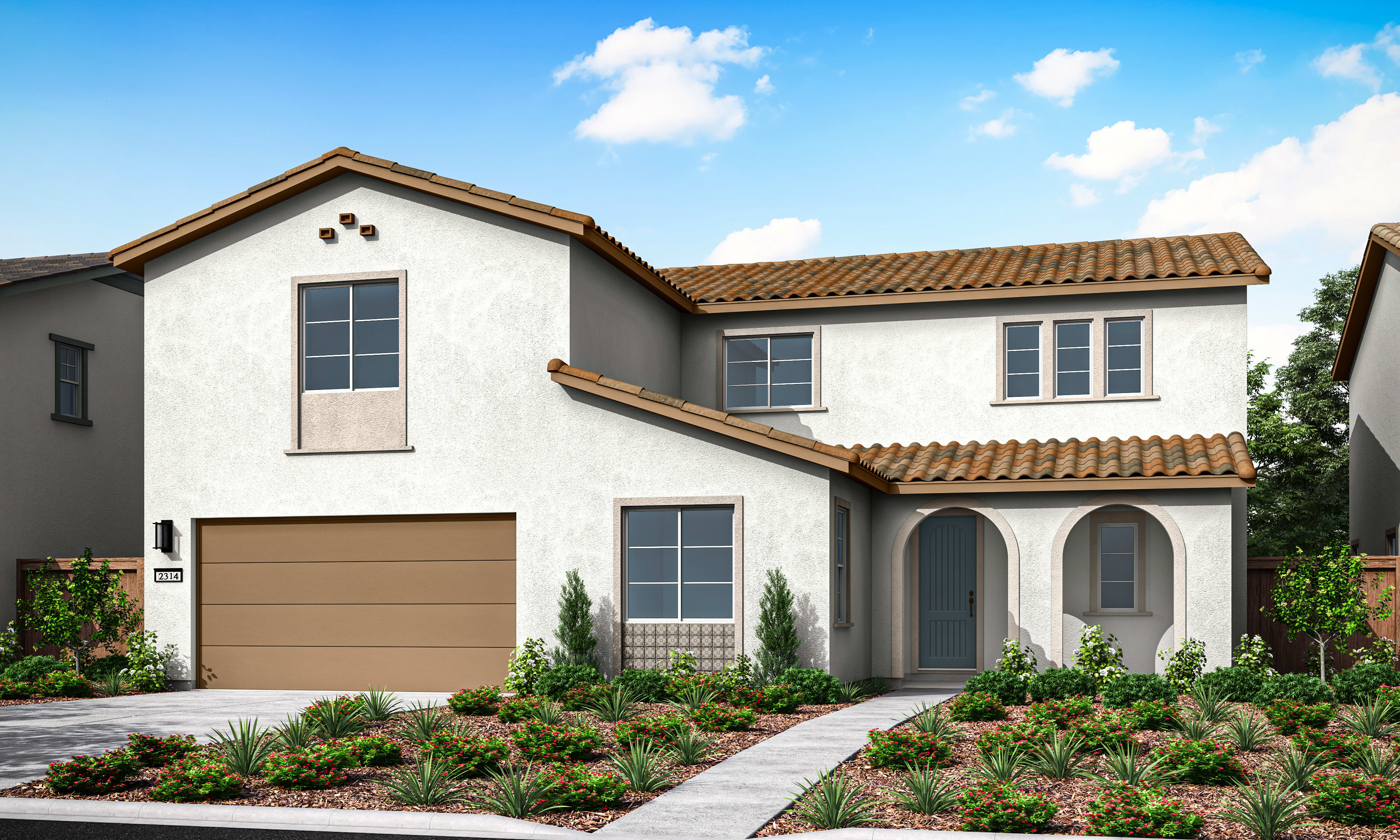 A two-story Mediterranean-style house with a tiled roof, a garage, and a well-landscaped front yard featuring various plants and shrubs against a backdrop of a blue sky with fluffy white clouds.