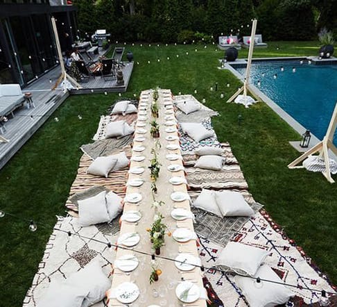 Backyard party patio set up for guests after mosquito event spraying
