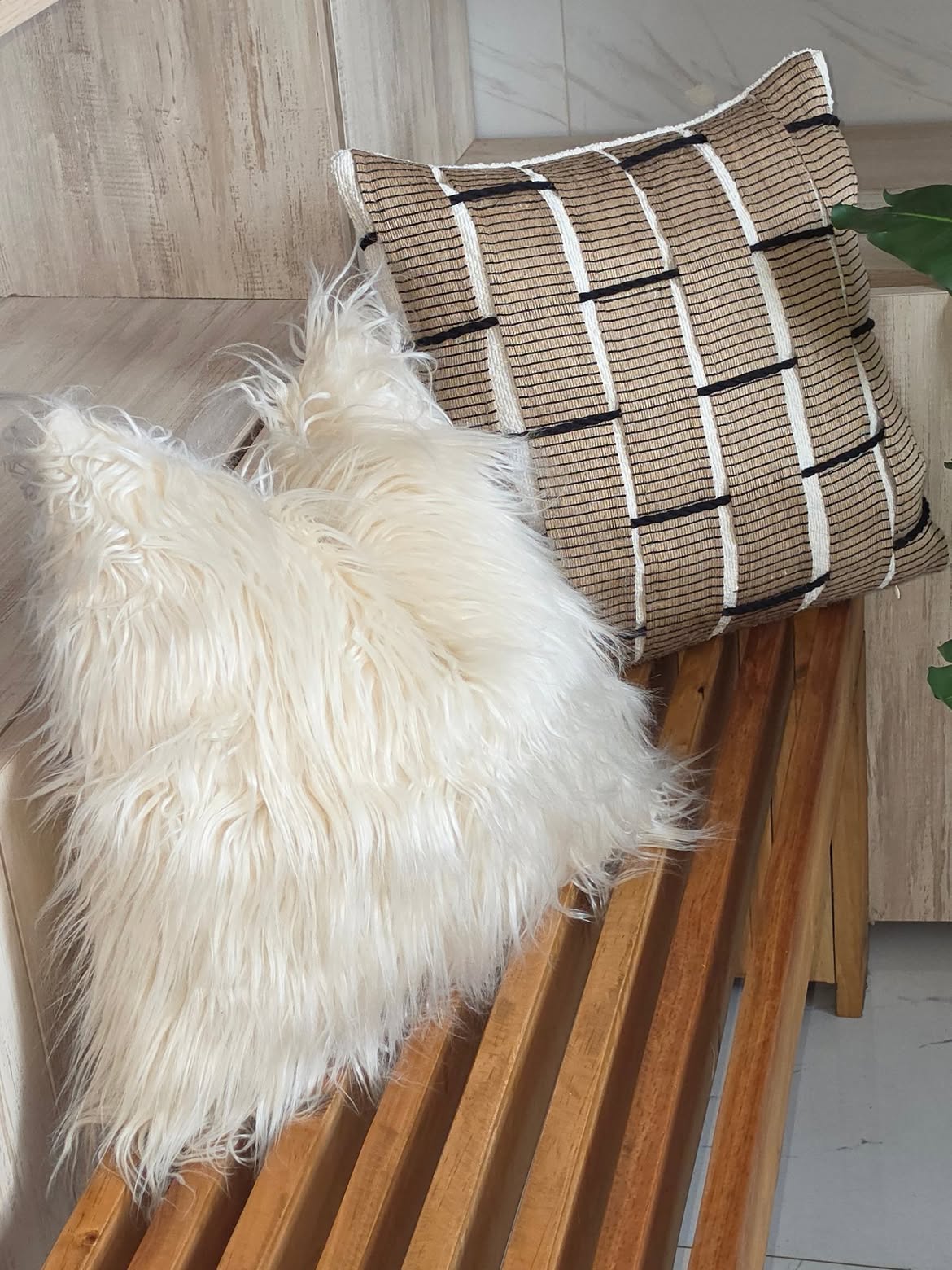 Coordinated throw pillows across a full sofa set in a collected Kenyan living room