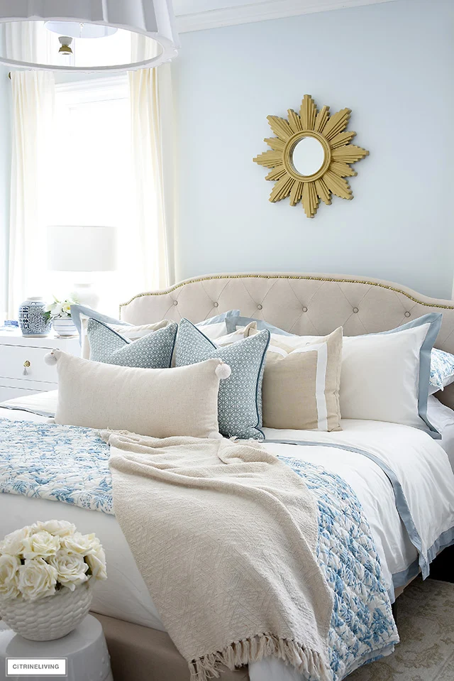 Styled 5x6 bed with two sleeping pillows, shams and a decorative accent pillow