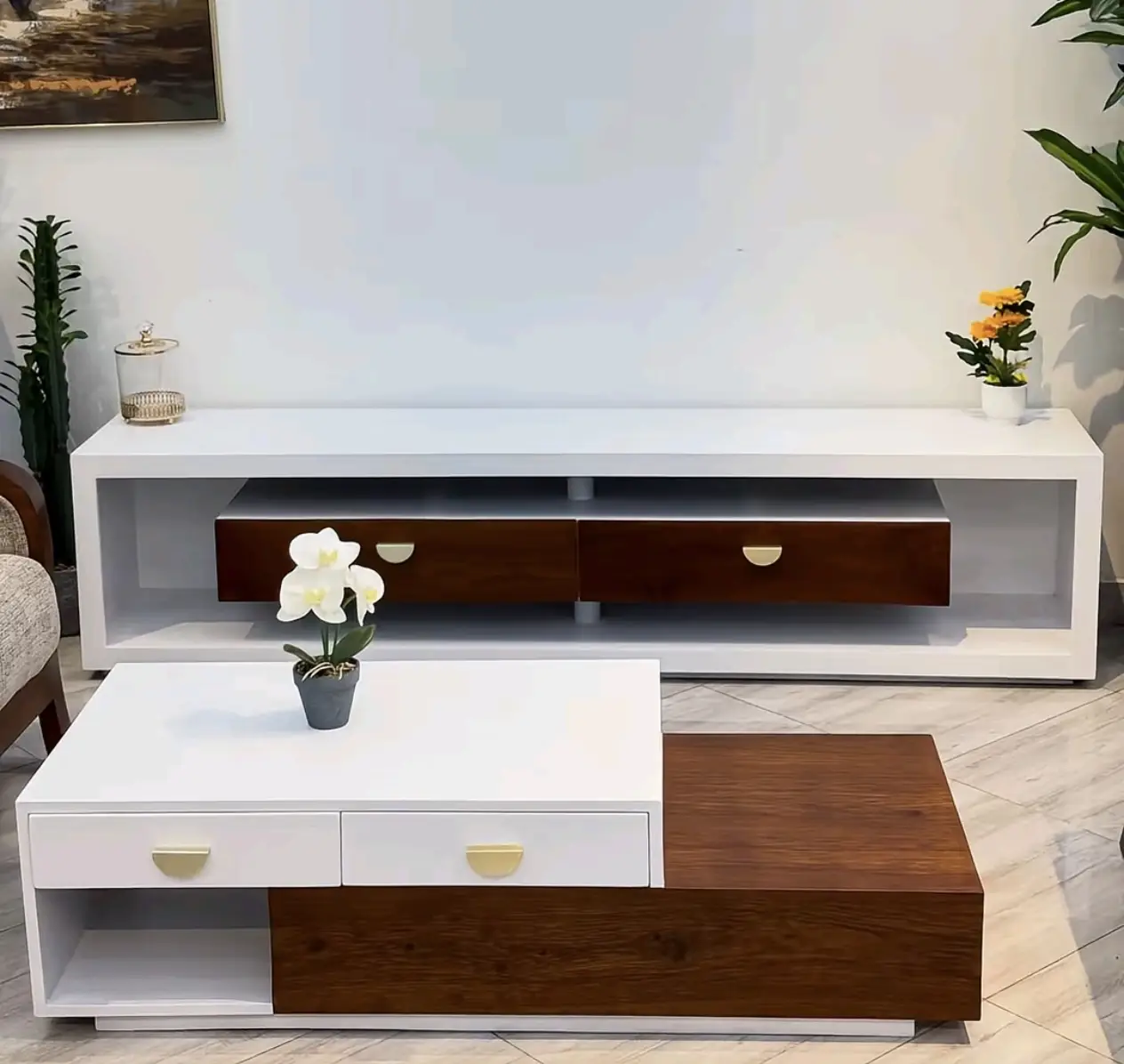 Styled coffee table with tray and books beside a matching TV stand in Kenya
