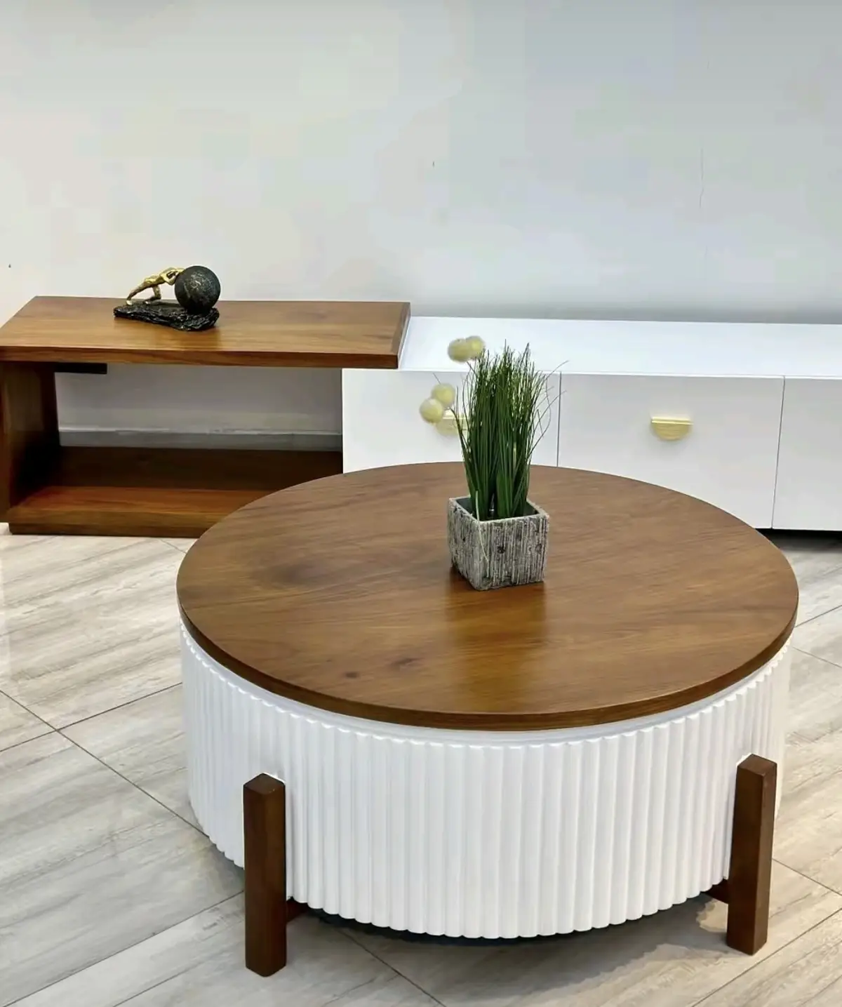 Long low TV stand sized for a large screen with matching coffee table in Kenya