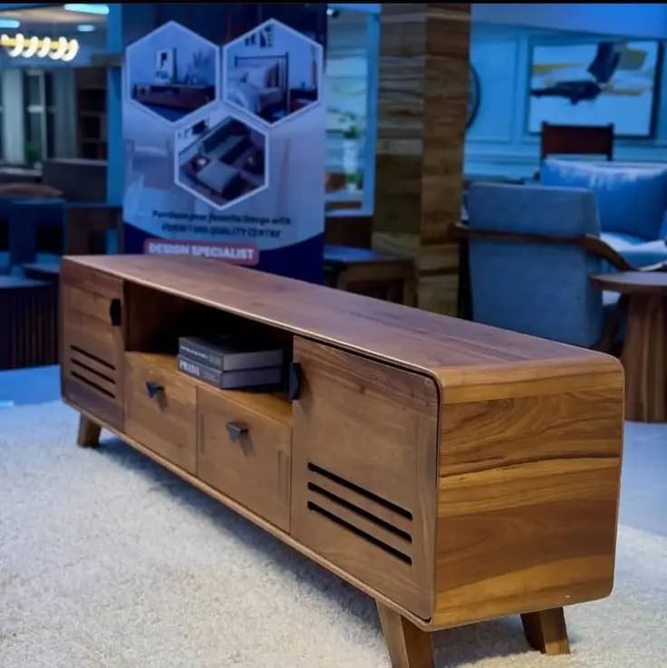 Solid wood TV stand sized correctly wider than the television screen