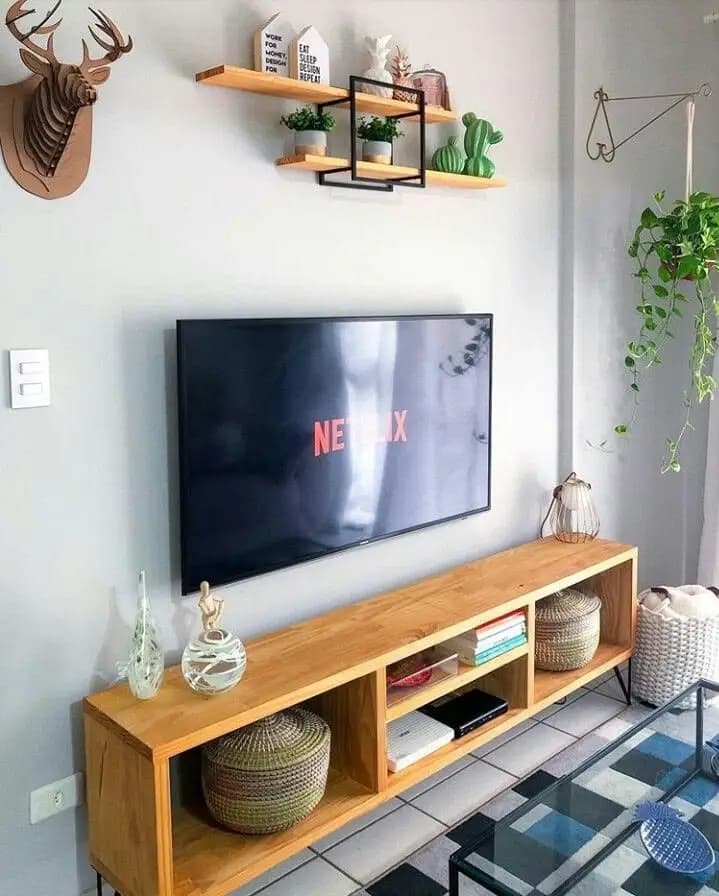 Close-up of solid wood grain on a TV stand showing real timber edges