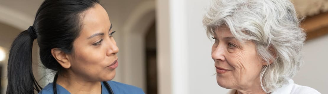 Doctor With Patient At Home