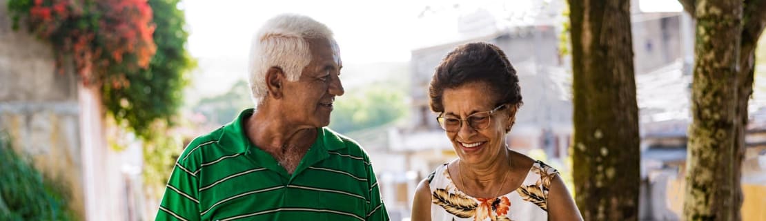 Elderly Couple Walking Smiling