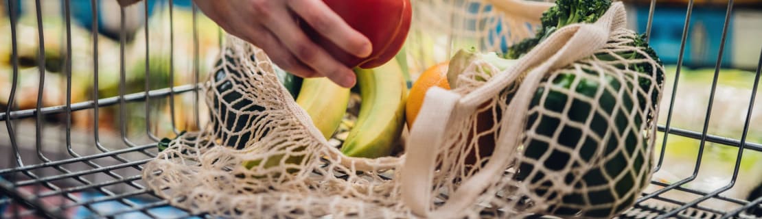Grocery Shopping With Reusable Shopping Bag At Supermarket