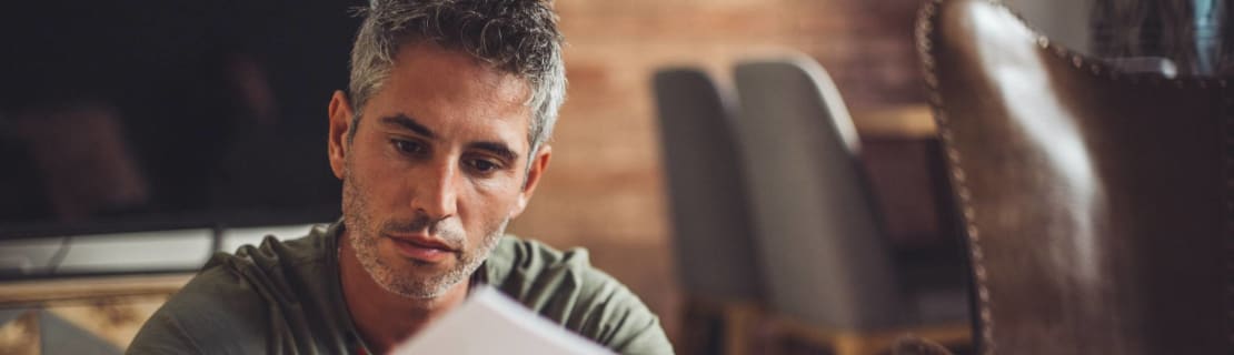Latino Man Stressed Paying Bills