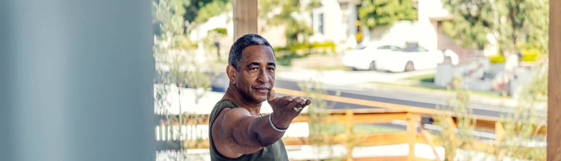 Mature Man Practicing Yoga Outdoors