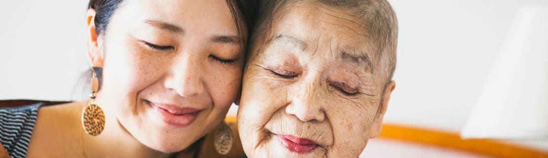 Portrait Of Old Mother With Cancer And Her Middle Aged Daughter