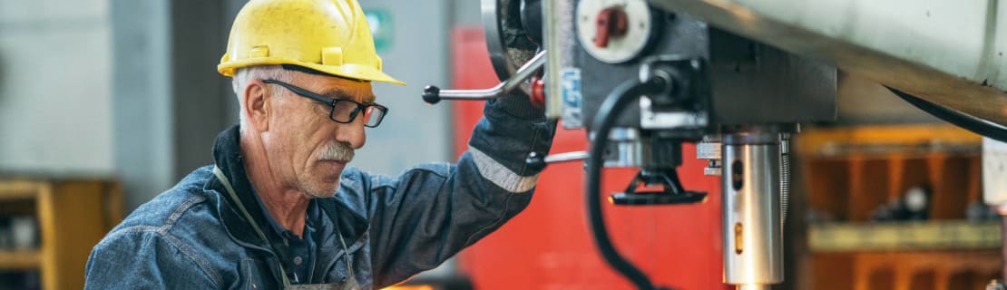Turner Worker Working On Drill Bit In A Workshop