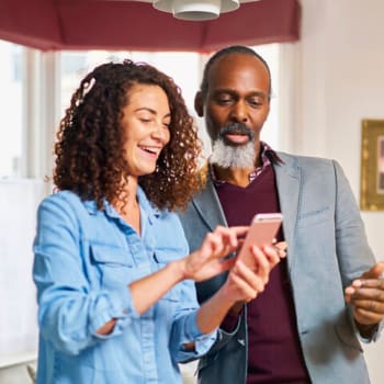 Couple comparing plans On their phone