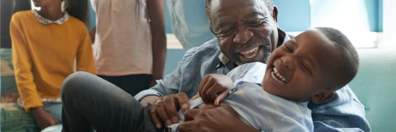 father and son laughing