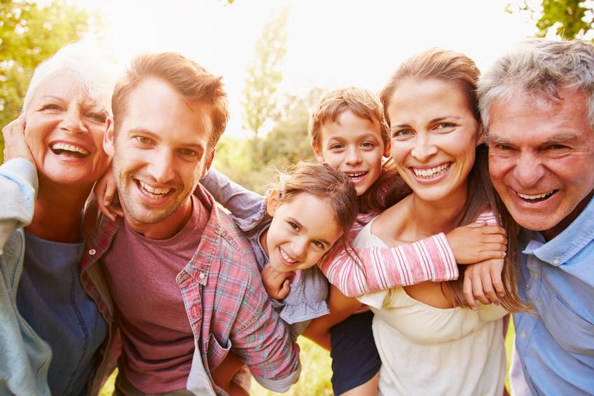 Family of all ages smiling 