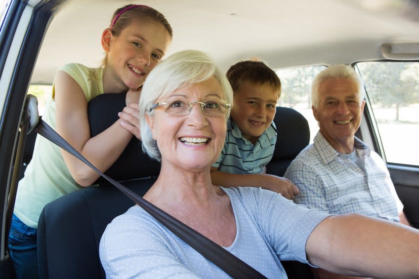 Grandparents drive grandkids in car