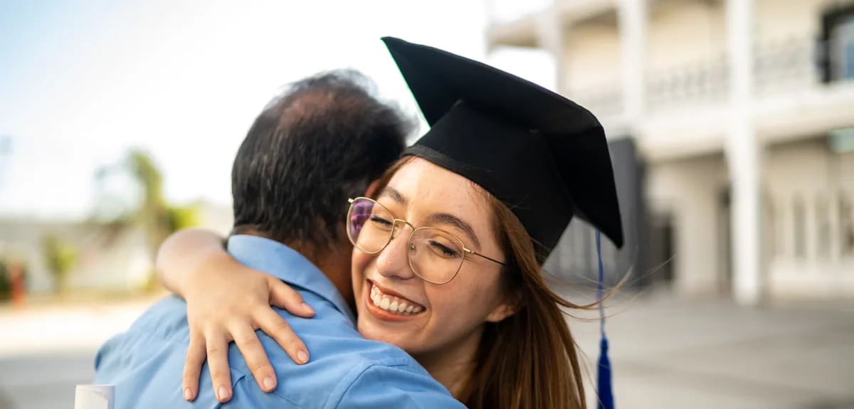 father hugging daughter