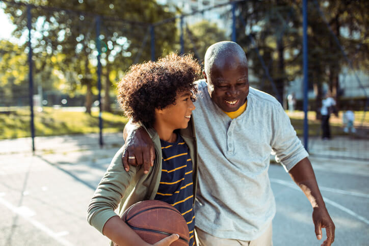 Man playing basketball with grandson