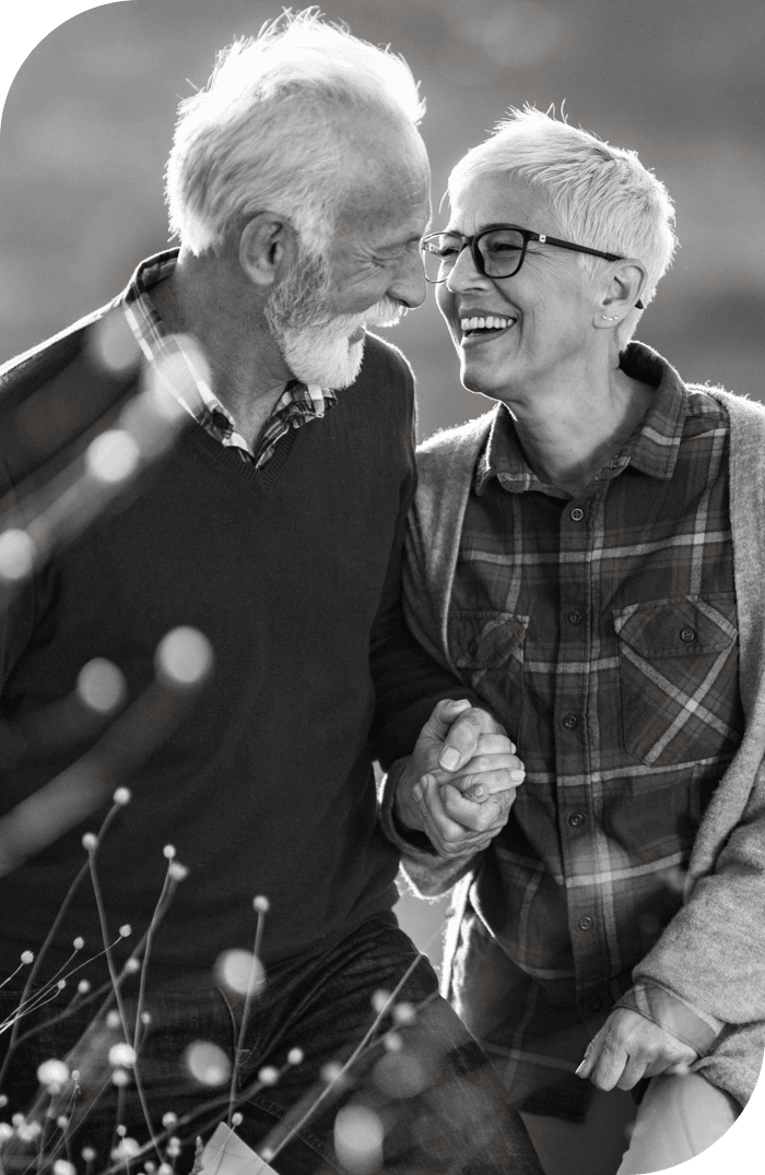 Senior couple looking at each other and holding hands