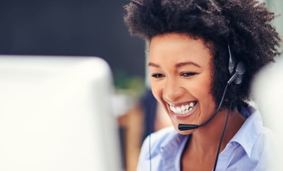 Smiling agent wearing a headset