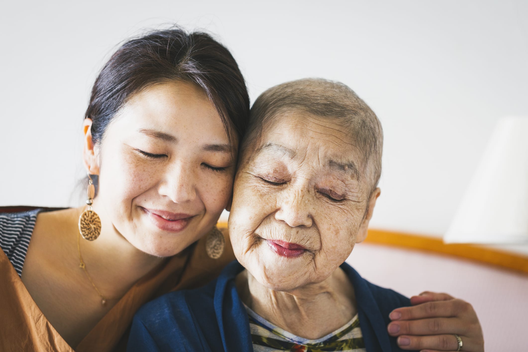 Portrait Of Old Mother With Cancer And Her Middle Aged Daughter