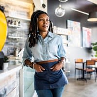 Barista Posing At Coffee Counter