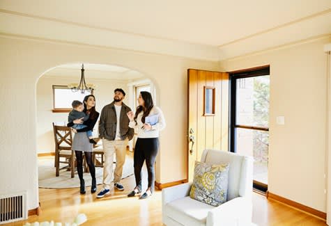 Real estate agent helps a family looking for rental apartment