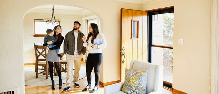 Real estate agent helps a family looking for rental apartment