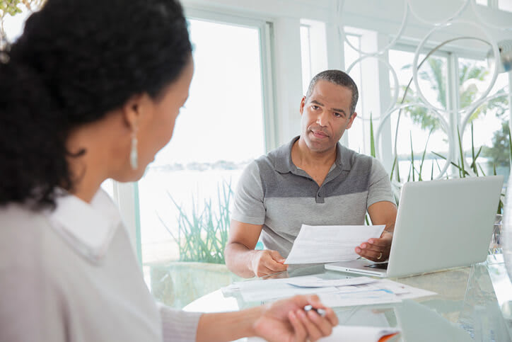 Serious couple reviewing medical bills