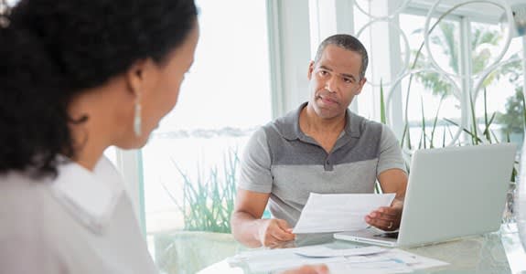 Serious couple reviewing medical bills