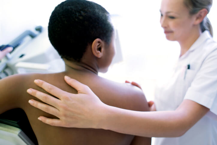 Back view of woman getting a mammogram