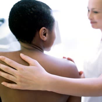 Back view of woman getting a mammogram