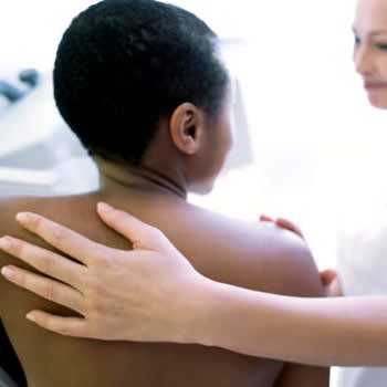 Back view of woman getting a mammogram