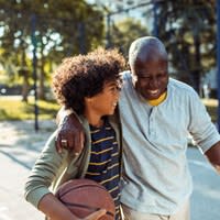 Man Playing Basketball With Grandson